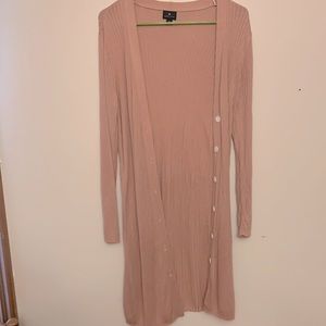 Long pink cardigan.
